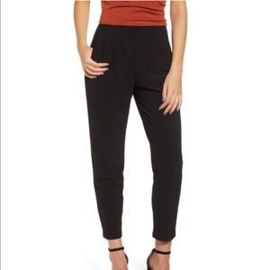 Black pleated trousers